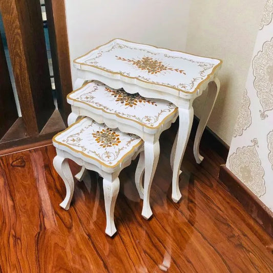 Elegant Fern Harmony wooden nesting tables placed in a modern interior, adding a touch of luxury and sophistication.