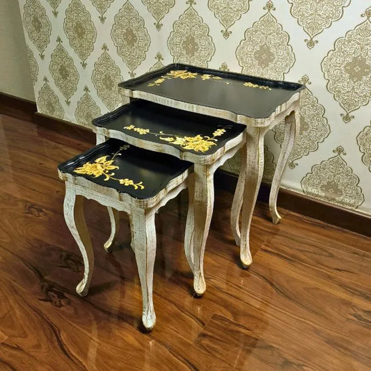 Golden Fern wooden nesting table set with hand-painted gold floral designs on a black surface, crafted from Kikar wood and MDF for an elegant home accent