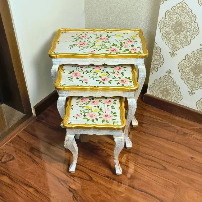 Space-saving Pink Rose nesting tables stacked together, featuring a beautifully hand-painted floral pattern with gold detailing