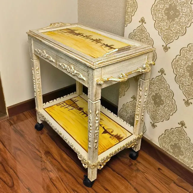 Close-up of hand-painted floral patterns on the Sea Voyage wooden serving trolley.